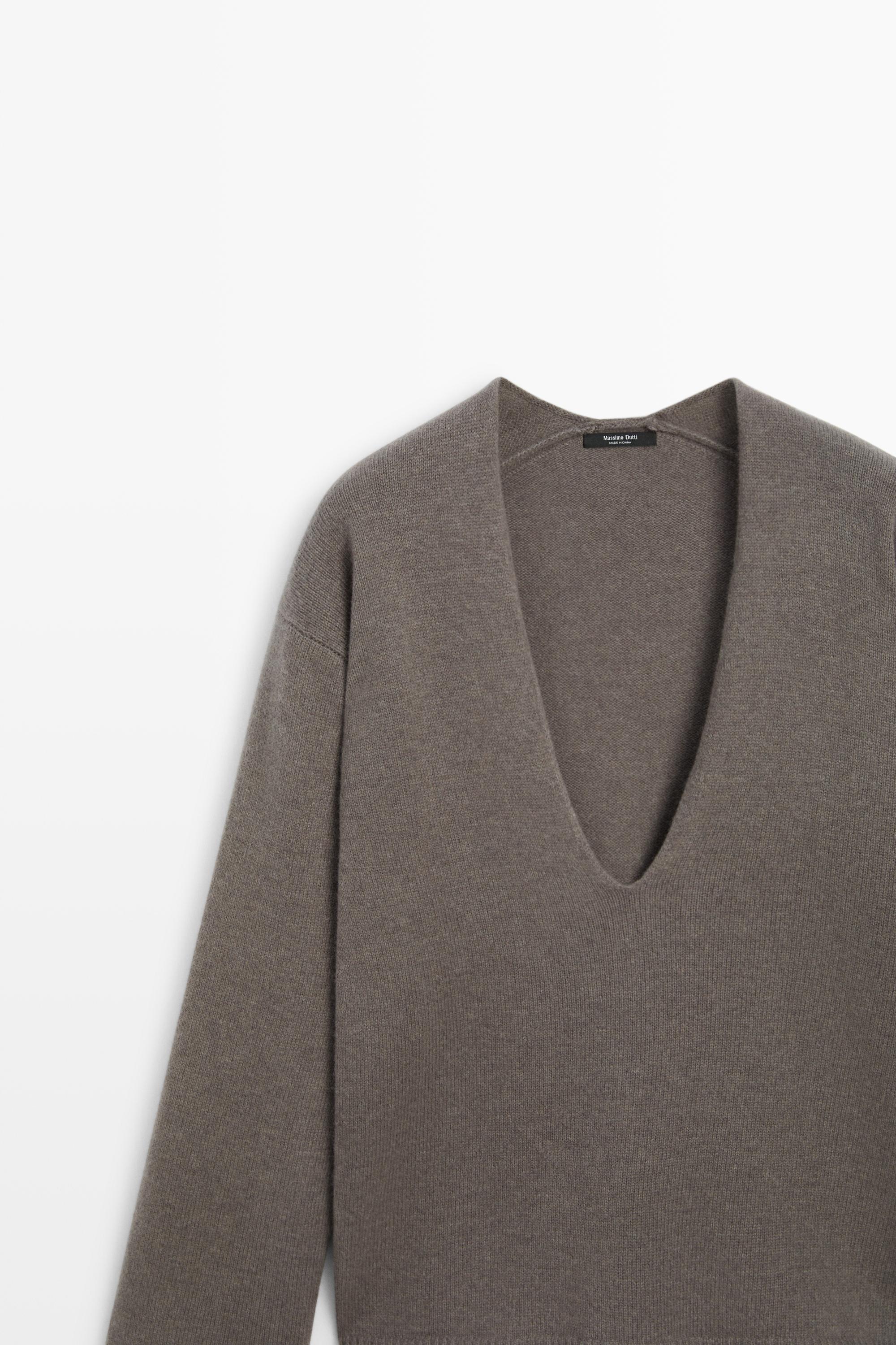 Long-line knit sweater with neckline detail